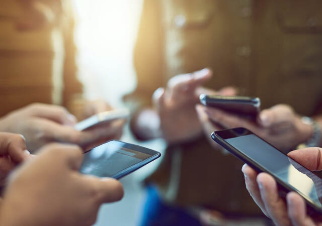 Colleagues using their smart phones