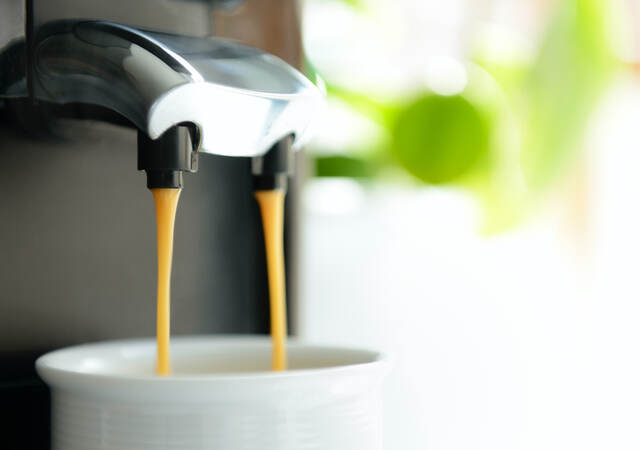Coffee brewing in front of sunlit window