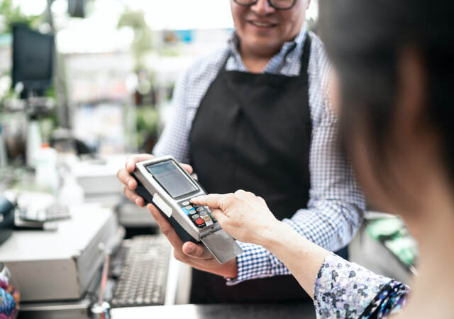 customer entering PIN code for payment