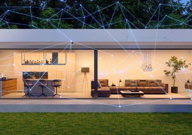 Modern home exterior with smart home control, mobile app and devices