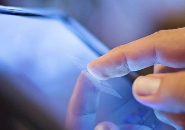 finger tapping a tablet