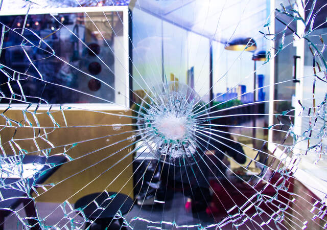 Unbroken bulletproof glass shown after it is shot.