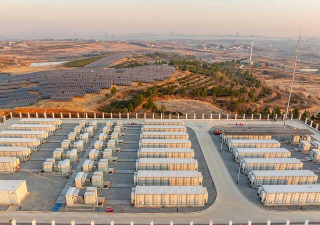 Overhead view of an energy power station next to a solar farm