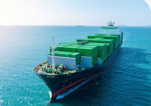 Full cargo ship making its way into port