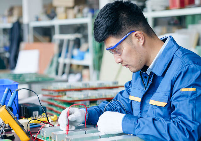 Repairman checking voltage