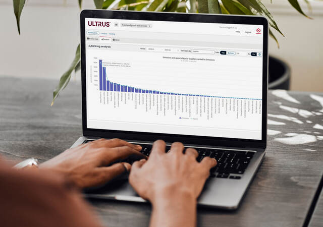 Person using ULTRUS™ Purchased Goods and Services Software module on a laptop to help determine their Scope 3 Category 1 emissions