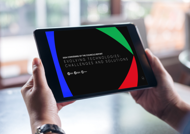 Person reading the 2024 Convening of the Councils report on a tablet