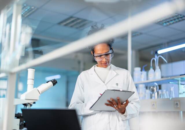 Young scientist noting results