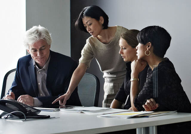 Four people working together on a project