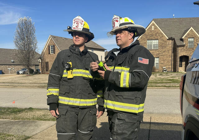 Two firefighters talking