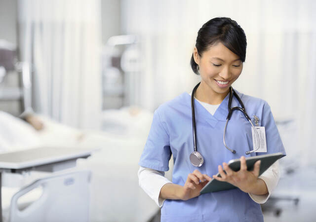 Doctor checking a chart in a hospital