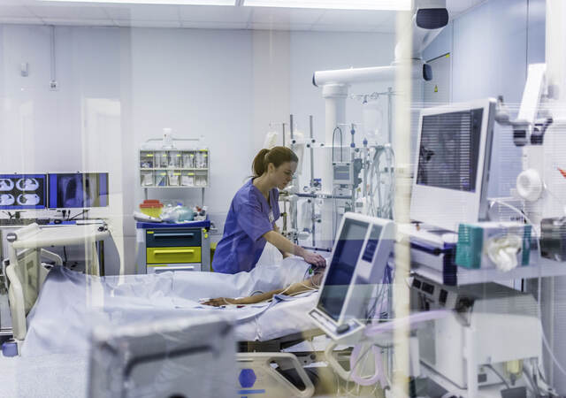 Doctor checking on a patient in a hospital