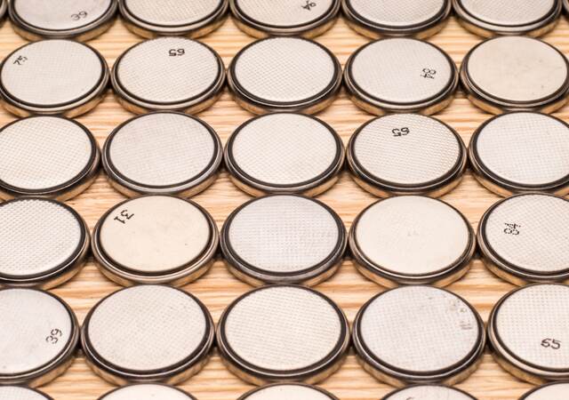 Several rows of button batteries
