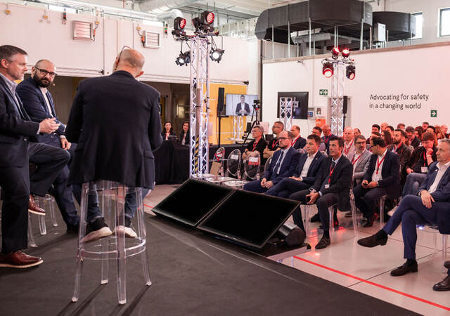 Speakers and audience at a heat pump conversation
