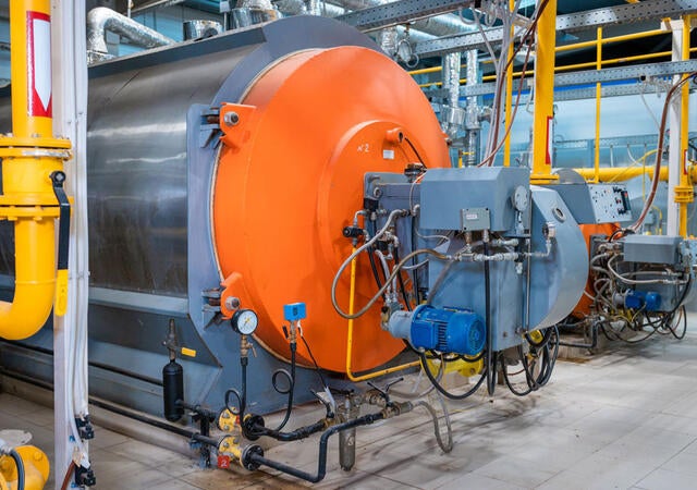 Industrial heating pipes and a large boiler