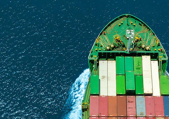 Shipping container sailing in the open sea