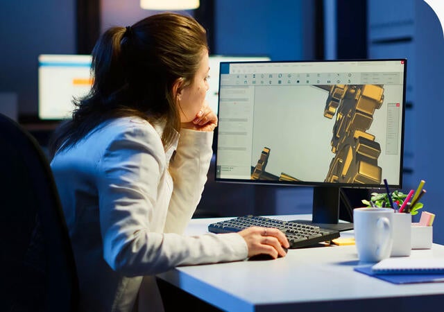 Industrial engineer studying prototype idea on pc showing cad software on device display