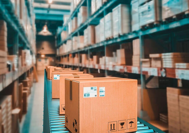 Parcels on conveyer belt in a warehouse
