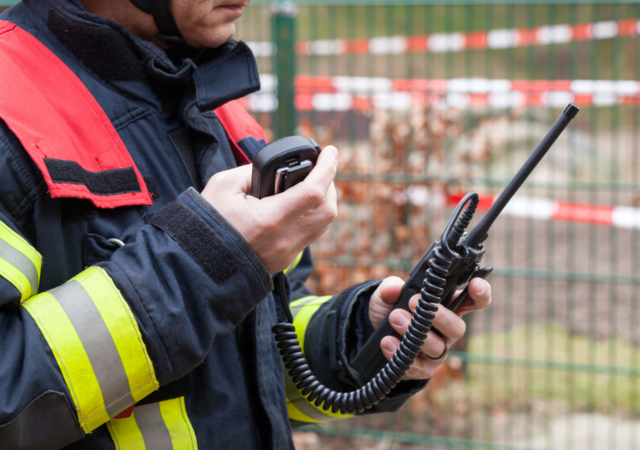 rescue worker using walkie talkie