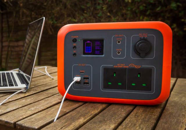 portable power pack charging a laptop