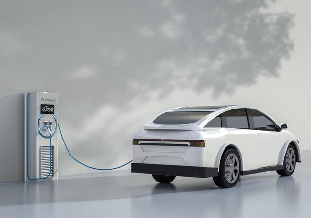 An electric vehicle charging at a port