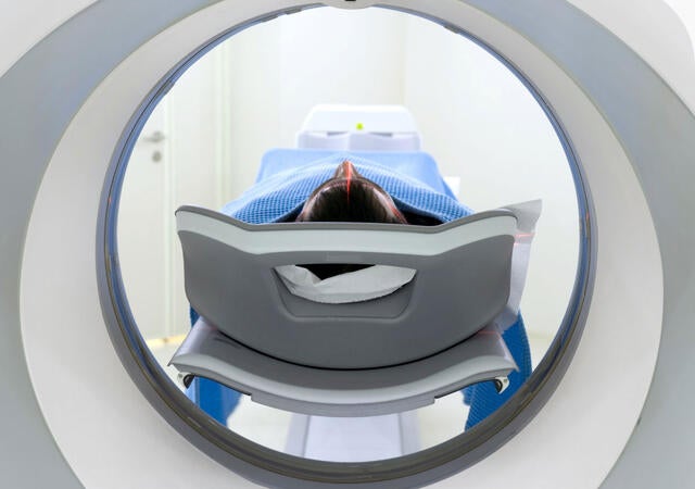 Rear view of a patient receiving an MRI