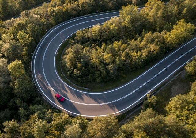curving road in wooded area