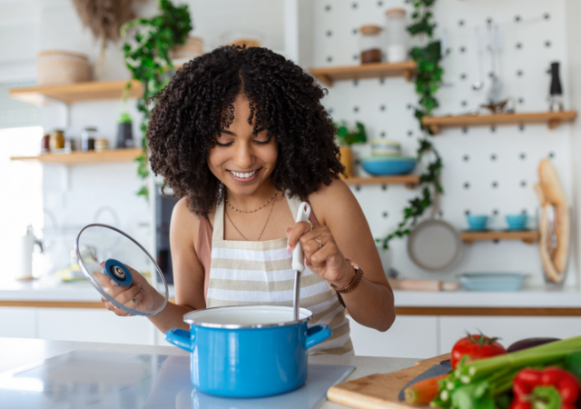 woman cooking soup
