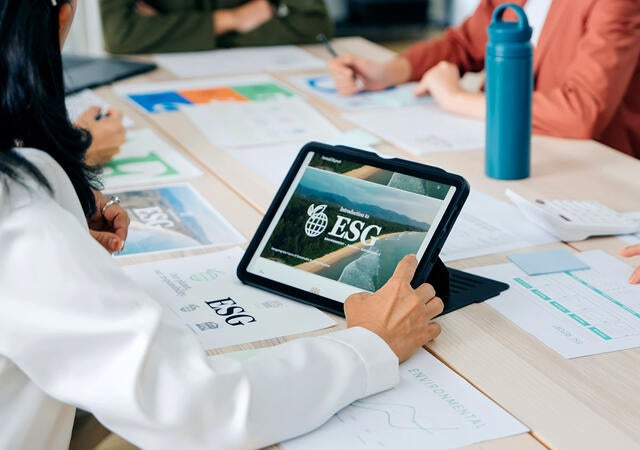 People in a meeting using ESG software