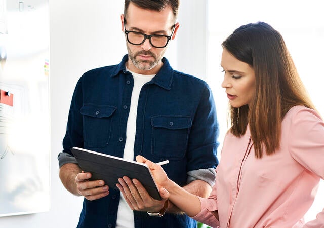 Two people working on a table