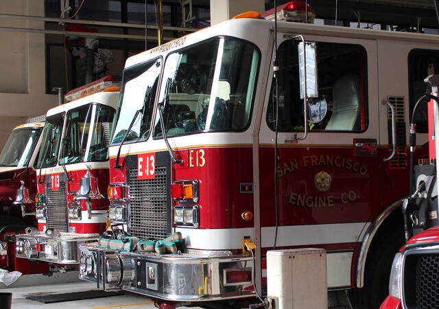 Line of fire trucks in a fire station