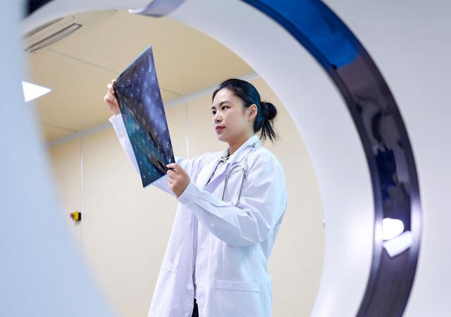 A doctor checking and MRI film