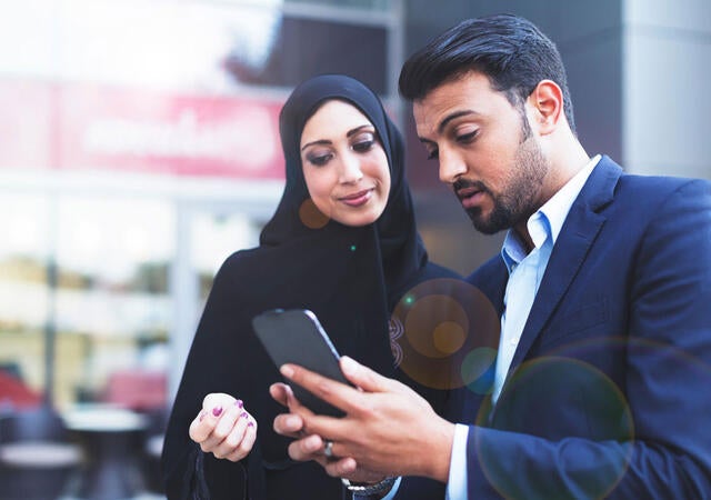 A person sharing information on a cellphone