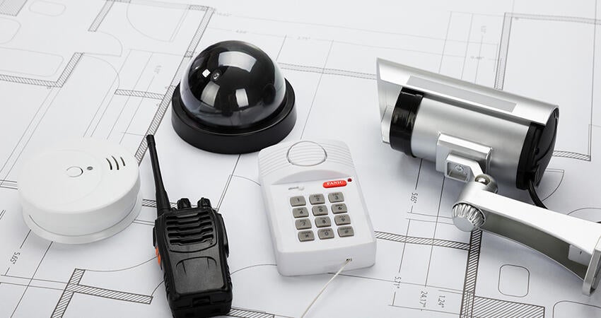 Security system equipment laying on a table.