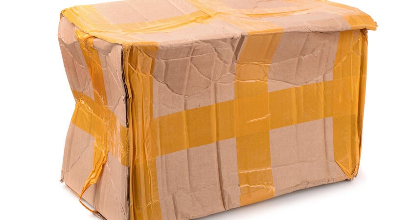 A beaten-up cardboard box. 