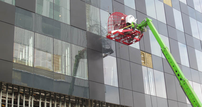 Commercial building envelope with wind load fan