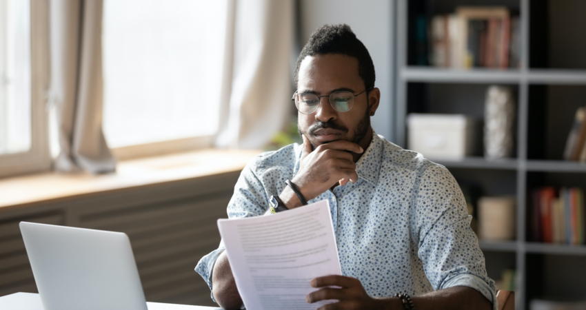 man looking at papers