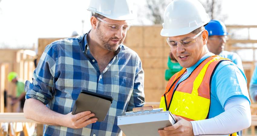 Construction managers discuss building plans