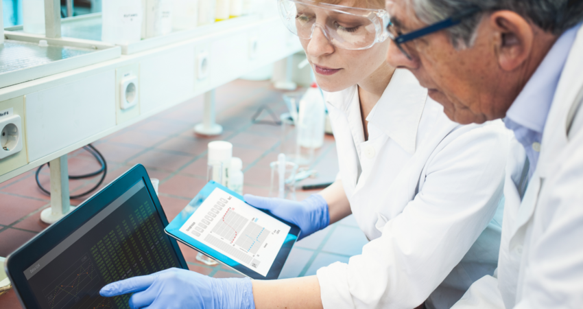 Scientists Discussing and Using Computer Software