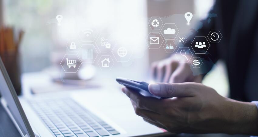 businessman working with laptop computer and digital tablet and smart phone in modern office with virtual icons interface