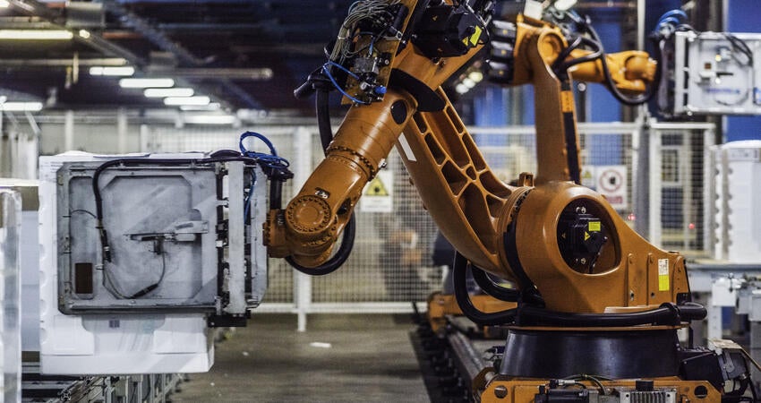 Robotic arms working on an assembly line