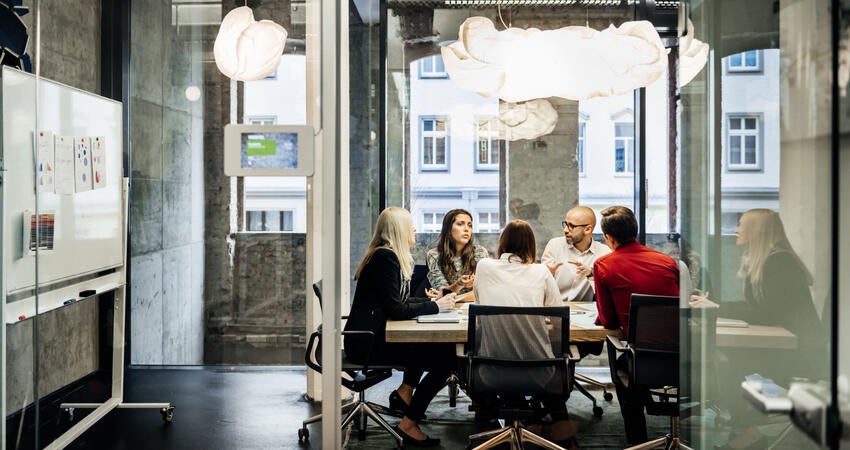 People having a meeting in a conference room
