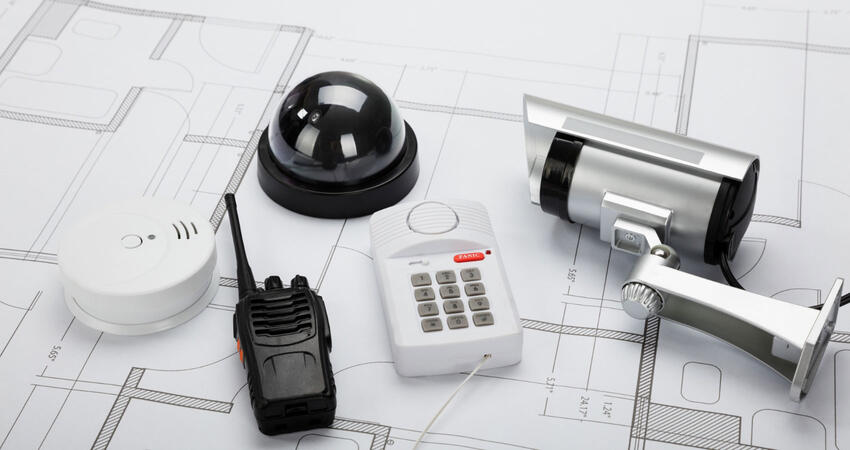 Security system equipment laying on a table.