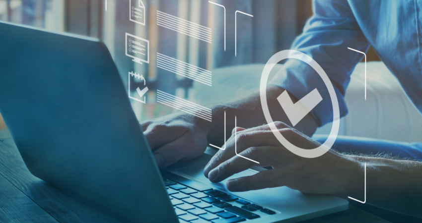 Person using laptop to verify data