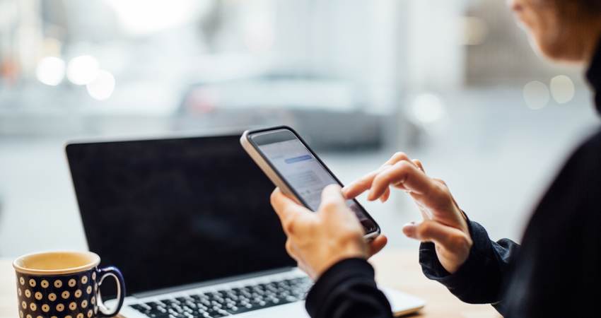 Texting on smart phone.