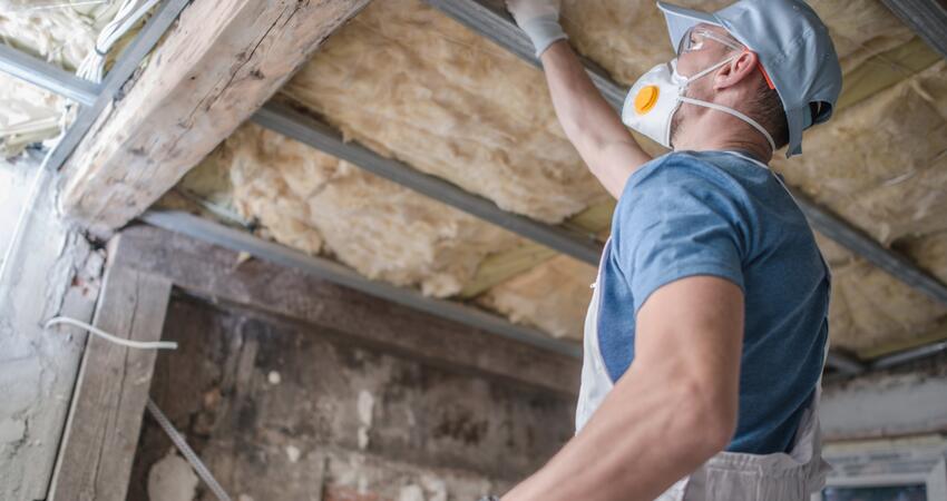 Replacing old attic mineral wool insulation.