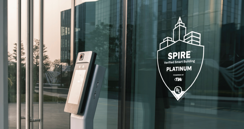 spire logo on glass window near a security checkpoint