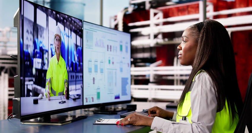 Person taking an online LMS course inside an office at a factory