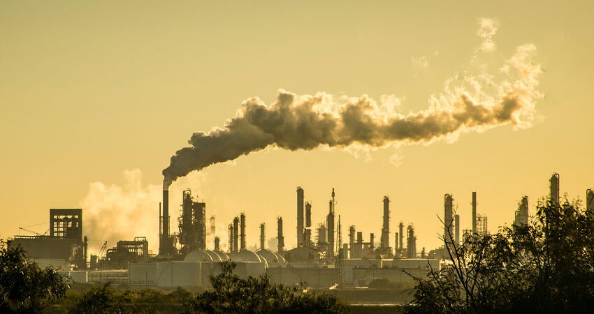 Smoke billowing from factory smokestacks