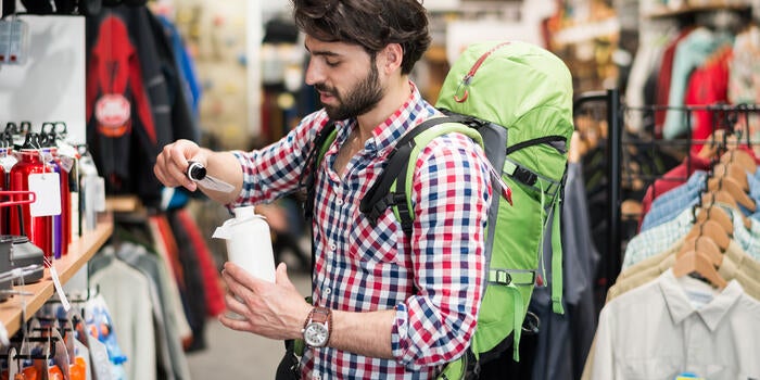 Male customer testing sports equipment in the store